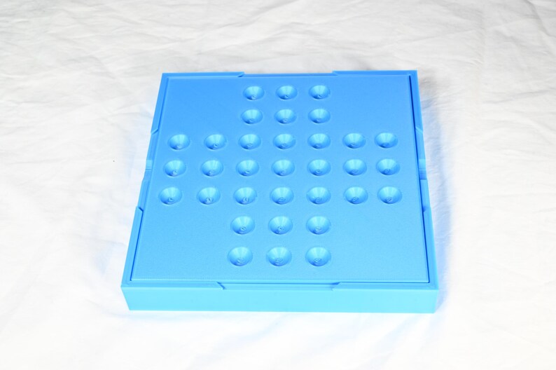 Solitaire game, marble game for one person. Board game for one complete in its own storage box