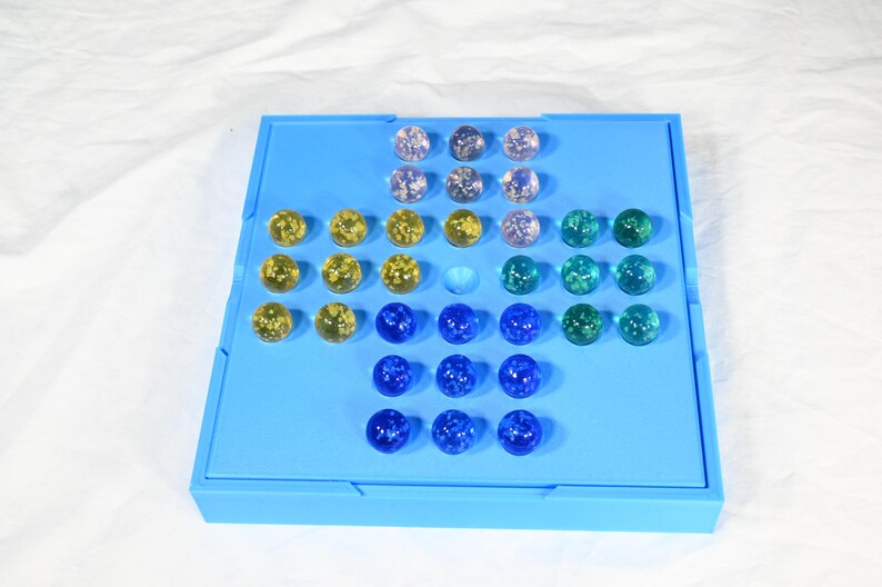 Solitaire game, marble game for one person. Board game for one complete in its own storage box