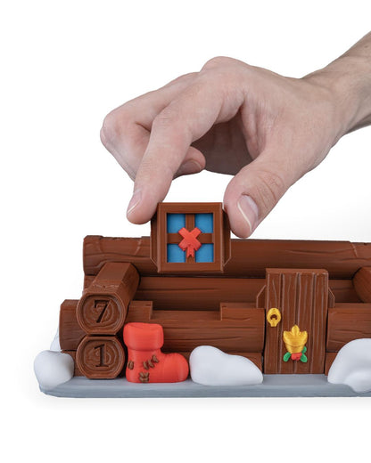 Santa's cabin advent calendar. Count down the days by building Santa's house. North Pole cabin