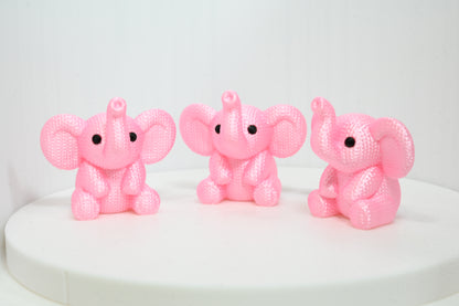 Super cute knitted style elephant with trunk in the air