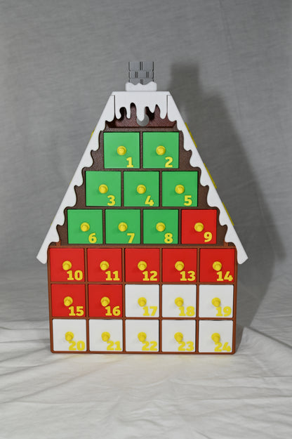 House shaped Christmas advent calendar with individually numbered drawers to countdown to Christmas day