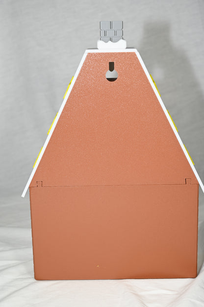 House shaped Christmas advent calendar with individually numbered drawers to countdown to Christmas day