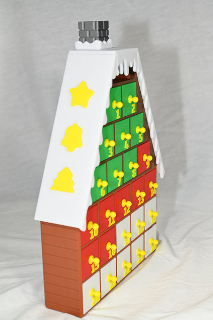 House shaped Christmas advent calendar with individually numbered drawers to countdown to Christmas day