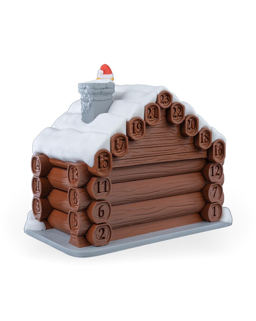 Santa's cabin advent calendar. Count down the days by building Santa's house. North Pole cabin