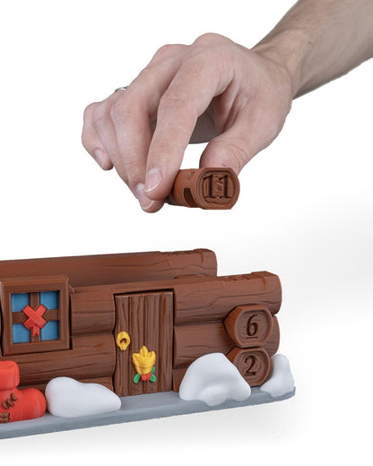 Santa's cabin advent calendar. Count down the days by building Santa's house. North Pole cabin
