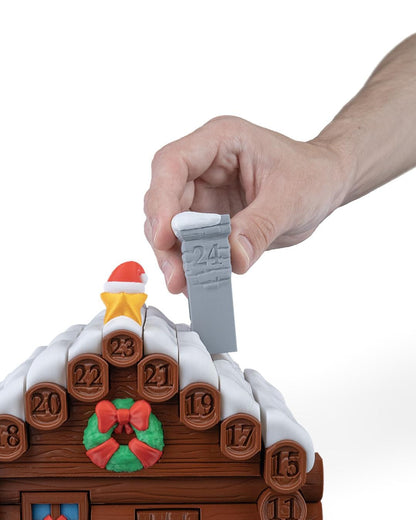 Santa's cabin advent calendar. Count down the days by building Santa's house. North Pole cabin
