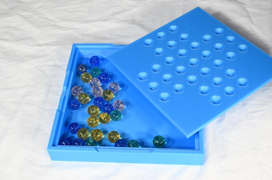 Solitaire game, marble game for one person. Board game for one complete in its own storage box